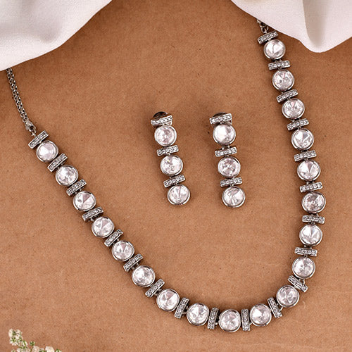 Intrinsically hand crafted White Gold Plated Polki Kundan Brass Necklace and matching Earrings set with American diamonds Online jewellery shopping