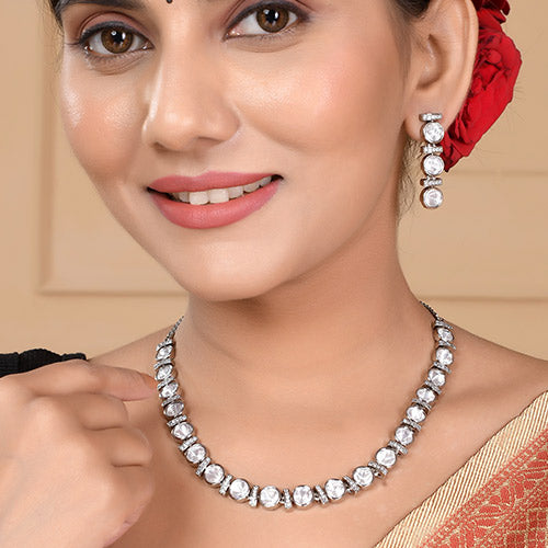 Intrinsically hand crafted White Gold Plated Polki Kundan Brass Necklace and matching Earrings set with American diamonds Online jewellery shopping