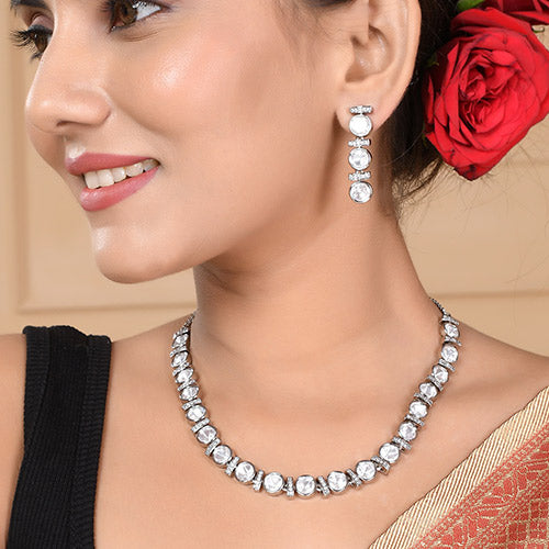 Intrinsically hand crafted White Gold Plated Polki Kundan Brass Necklace and matching Earrings set with American diamonds Online jewellery shopping