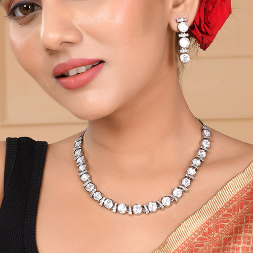 Intrinsically hand crafted White Gold Plated Polki Kundan Brass Necklace and matching Earrings set with American diamonds Online jewellery shopping